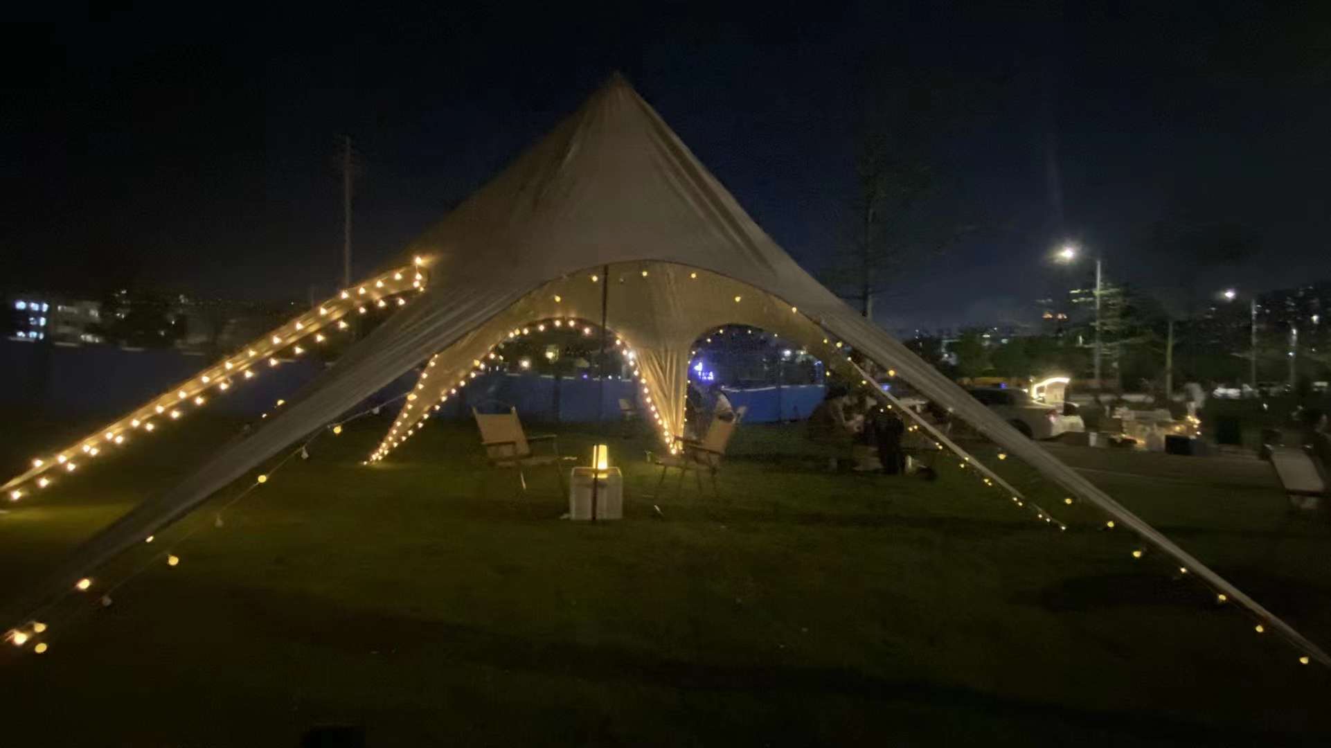 Star tent with LED lighting at a night brand event
