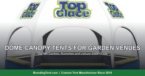 Dome canopy tent with printed panels used as a retail kiosk at a garden venue