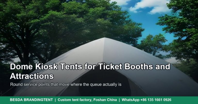 White dome tent with curved round roof and open entrance standing on a visitor site lawn