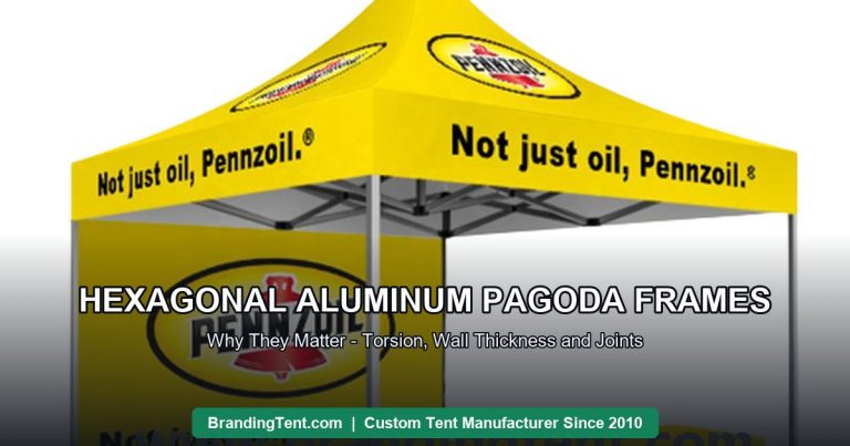 Custom high-peak pagoda tent with printed canopy standing on a hexagonal aluminum frame