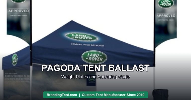 Custom event tent set with flag banners and printed walls, fully anchored installation