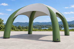 Complete green inflatable event canopy with rounded air-supported legs and a gray roof